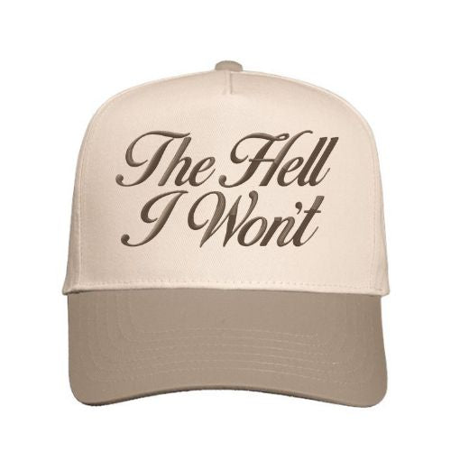 Natural and Beige trucker hat with “The Hell I Won’t” embroidered in script font on the front panel.