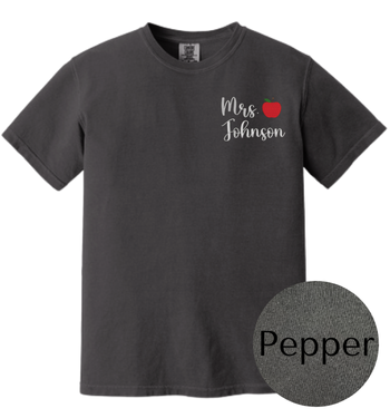 Black t-shirt with 'Mrs. Johnson' text and an apple design on a white background