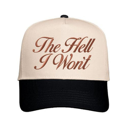 Natural and black trucker hat with “The Hell I Won’t” embroidered in script font on the front panel.
