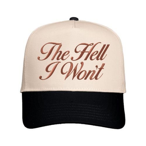 Natural and black trucker hat with “The Hell I Won’t” embroidered in script font on the front panel.