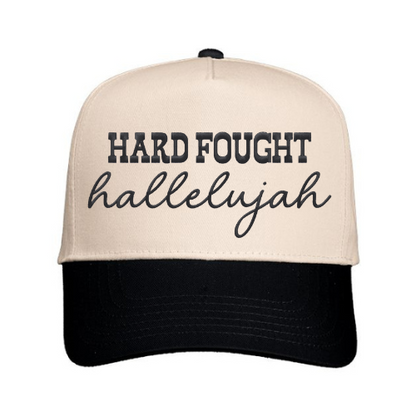 Custom embroidered ‘Hard Fought Hallelujah’ on a Natural & Black structured snapback cap
