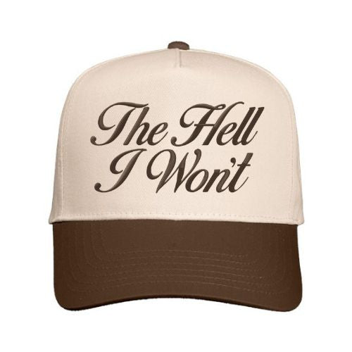Natural and brown trucker hat with “The Hell I Won’t” embroidered in script font on the front panel.