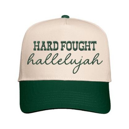 Custom embroidered ‘Hard Fought Hallelujah’ on a Natural & Green structured snapback cap