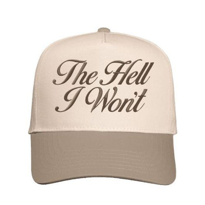 Natural and Beige trucker hat with “The Hell I Won’t” embroidered in script font on the front panel.