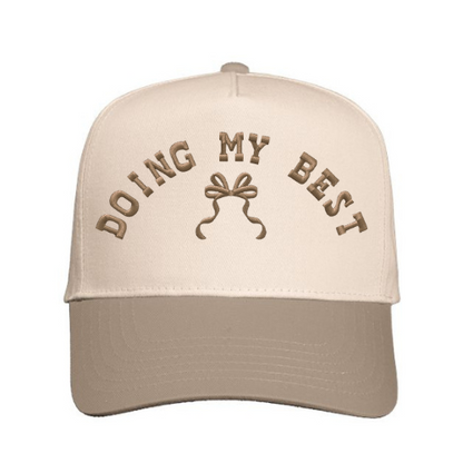 Cap embroidered with 'Doing My Best' text with bow design on a Natural & Khaki hat