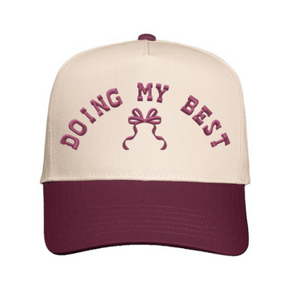 Cap embroidered with 'Doing My Best' text with bow design on a Natural & Maroon hat