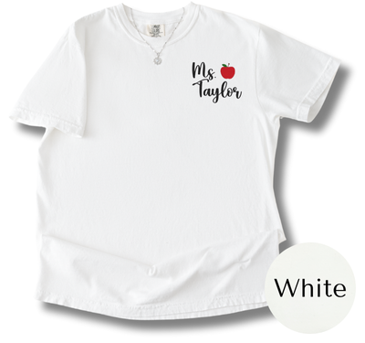 White shirt with 'Ms Taylor' and an apple graphic on a white background
